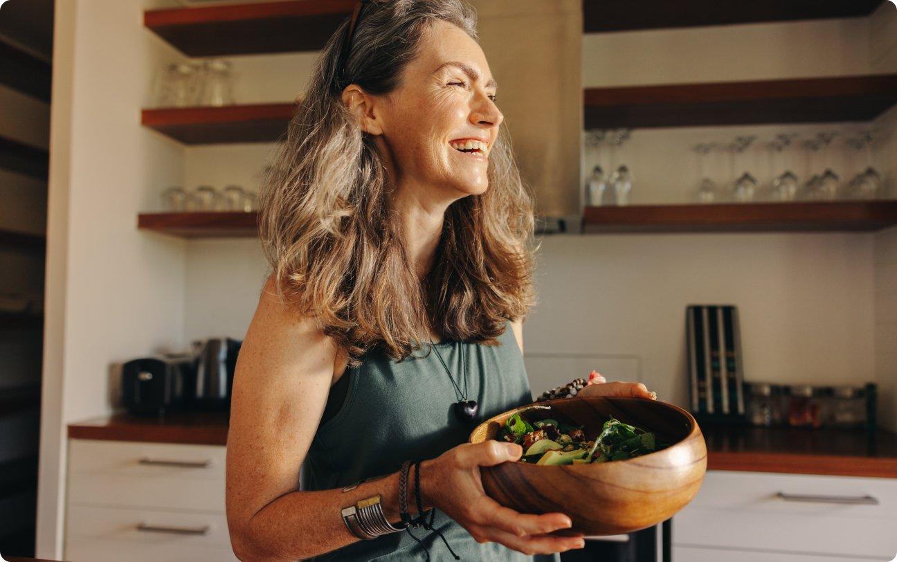 Woman holding salad bowl