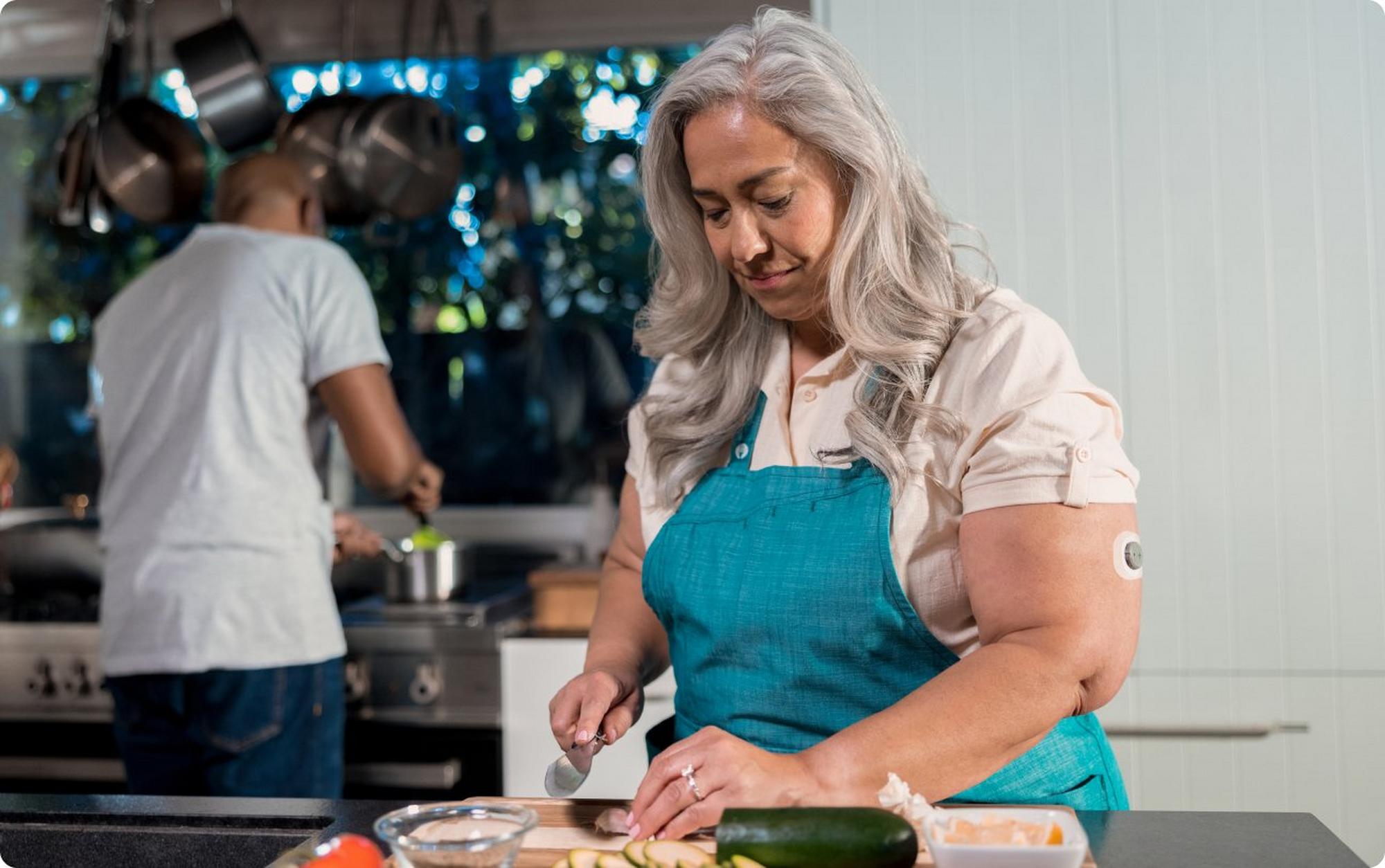Woman in kitchen doing food prep