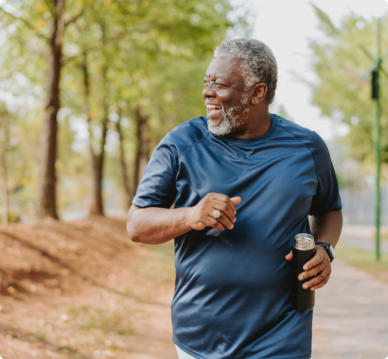 Man with water bottle going for a walk outside