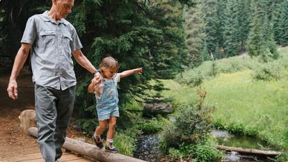 Man and child walking outdoors
