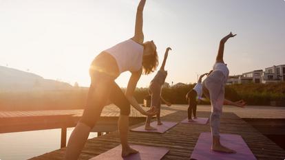 People practicing yoga outdoors