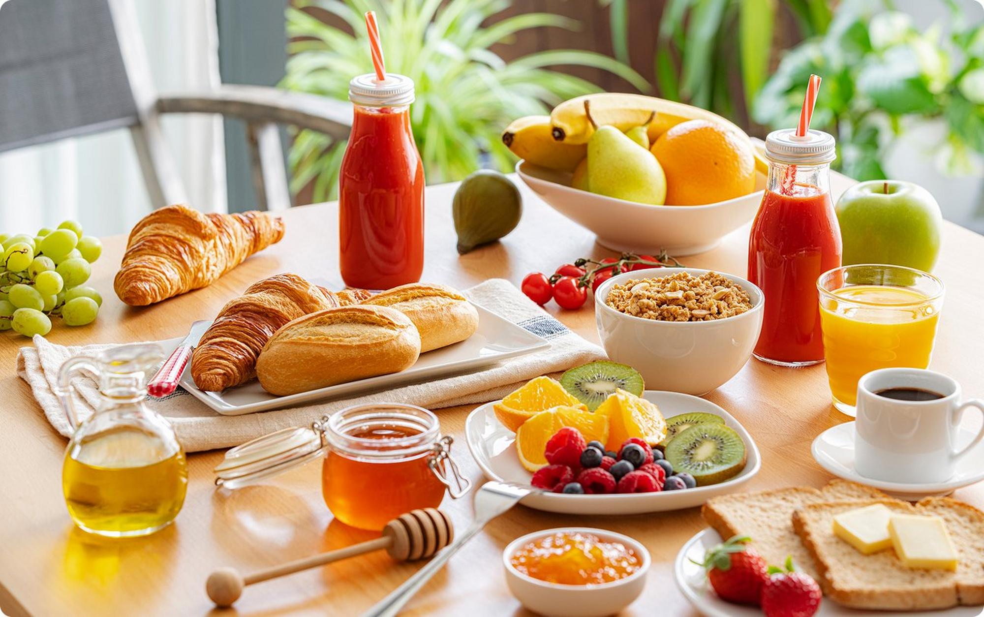 Table of sweets: pastries, fruits, juices