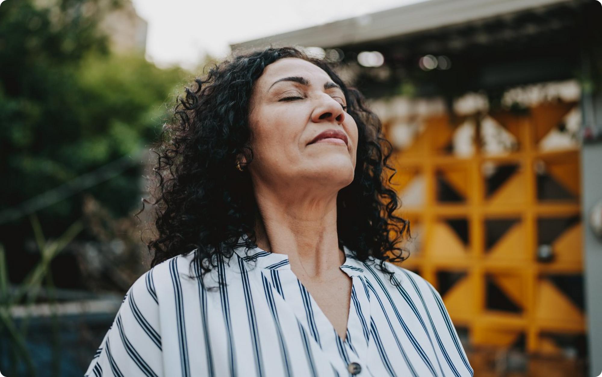 woman taking deep breath