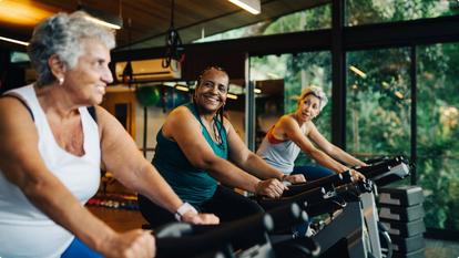 women on exercise bikes