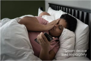 woman laying in bed with smartphone