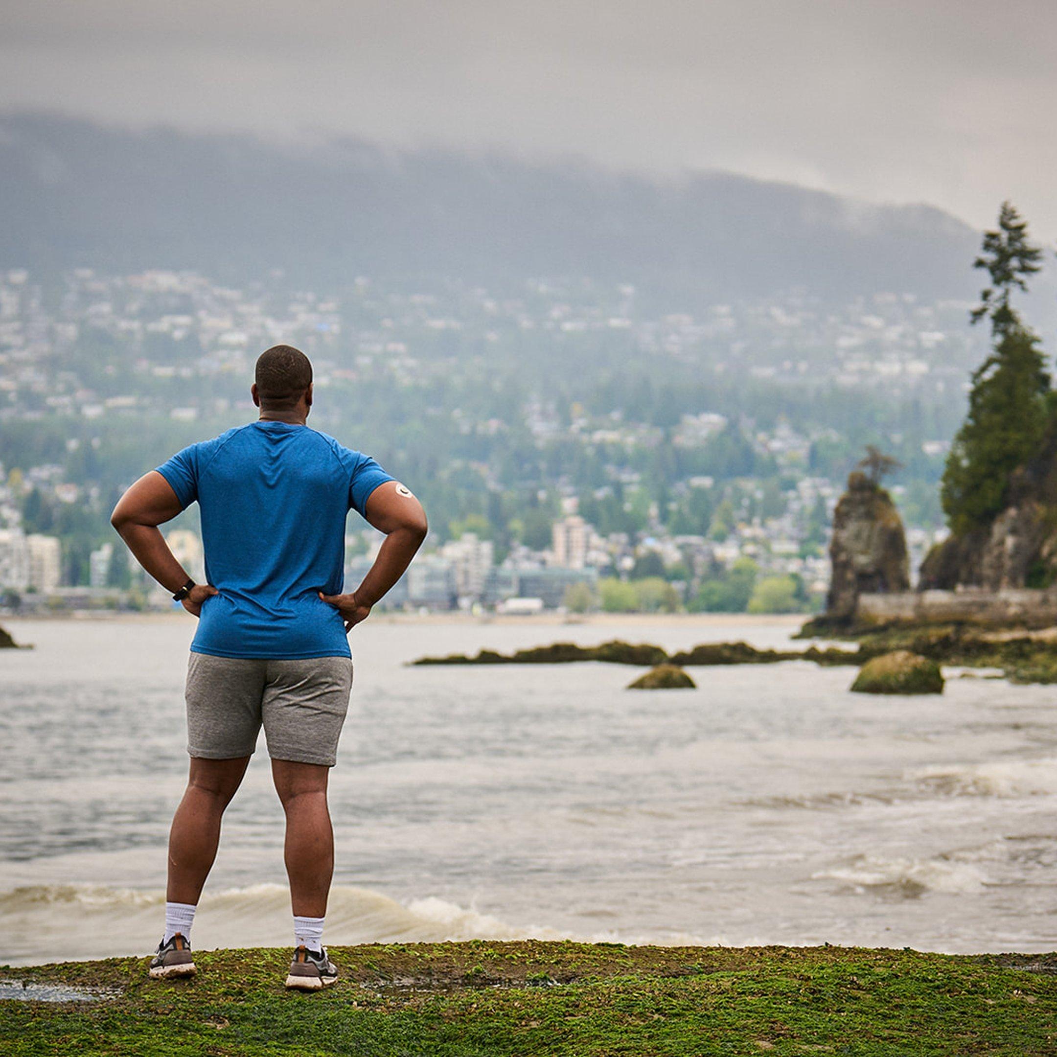 man wearing stelo looking at water