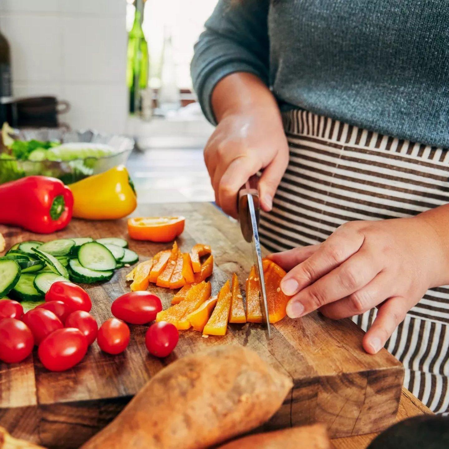 woman cutting vegetables