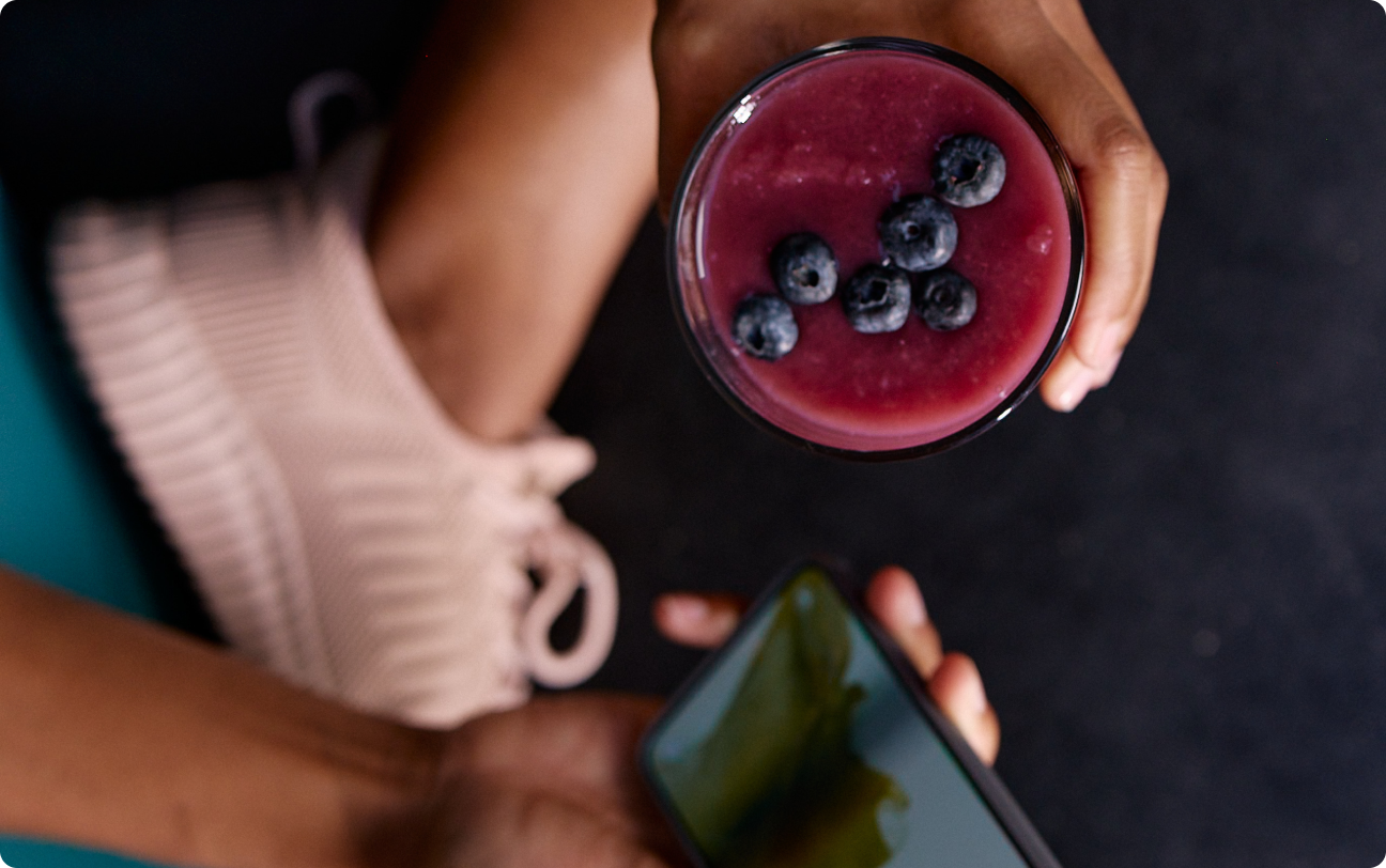 Person holding fruity drink