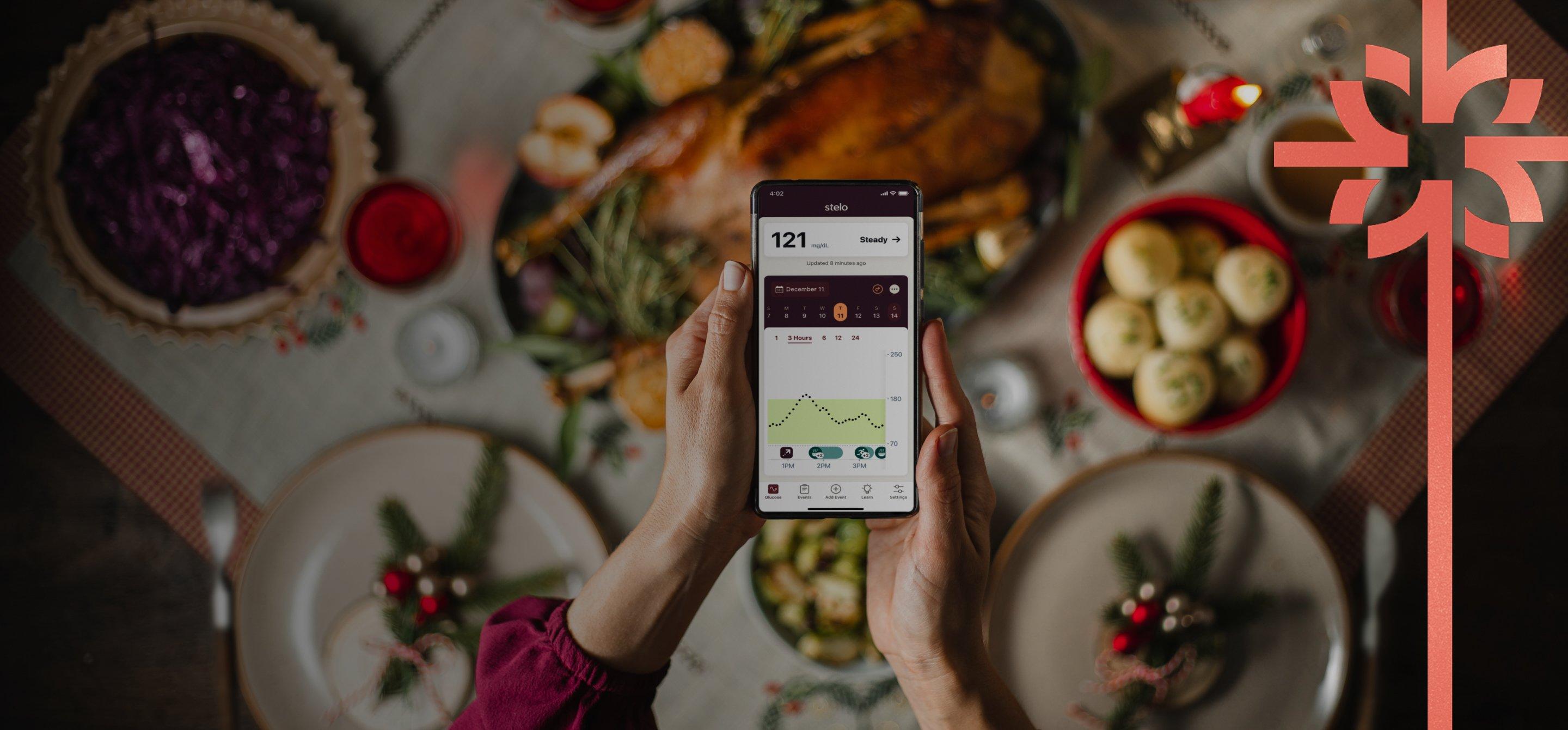 Woman looking at Stelo app on smart phone wearing Stelo glucose biosensor