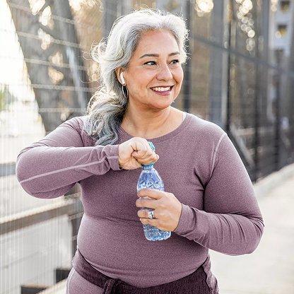 woman opening water bottle