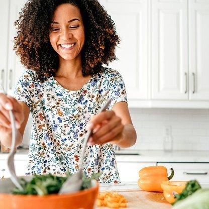 woman making salad