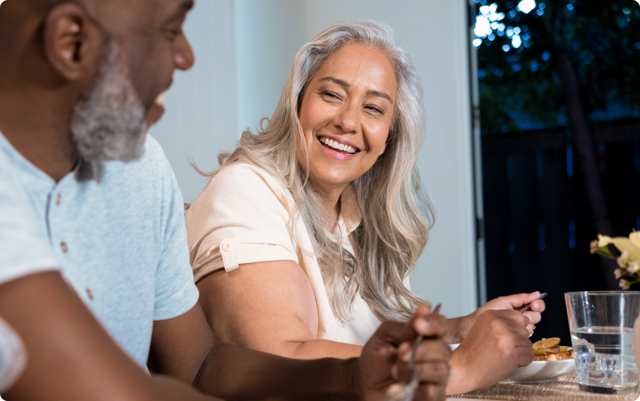 Man and woman sitting and eating together