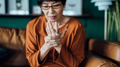 senior woman with joint pain in hands