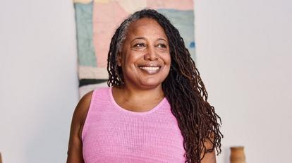 Senior woman smiling wearing pink top