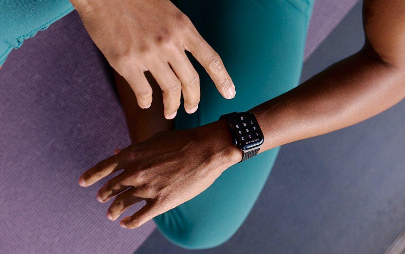 woman checking smartwatch