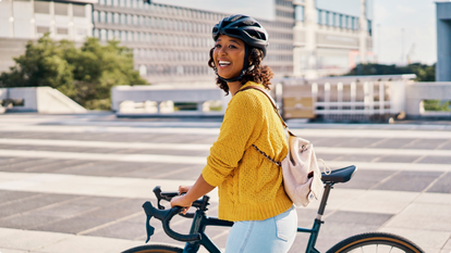 woman riding bike in plaza