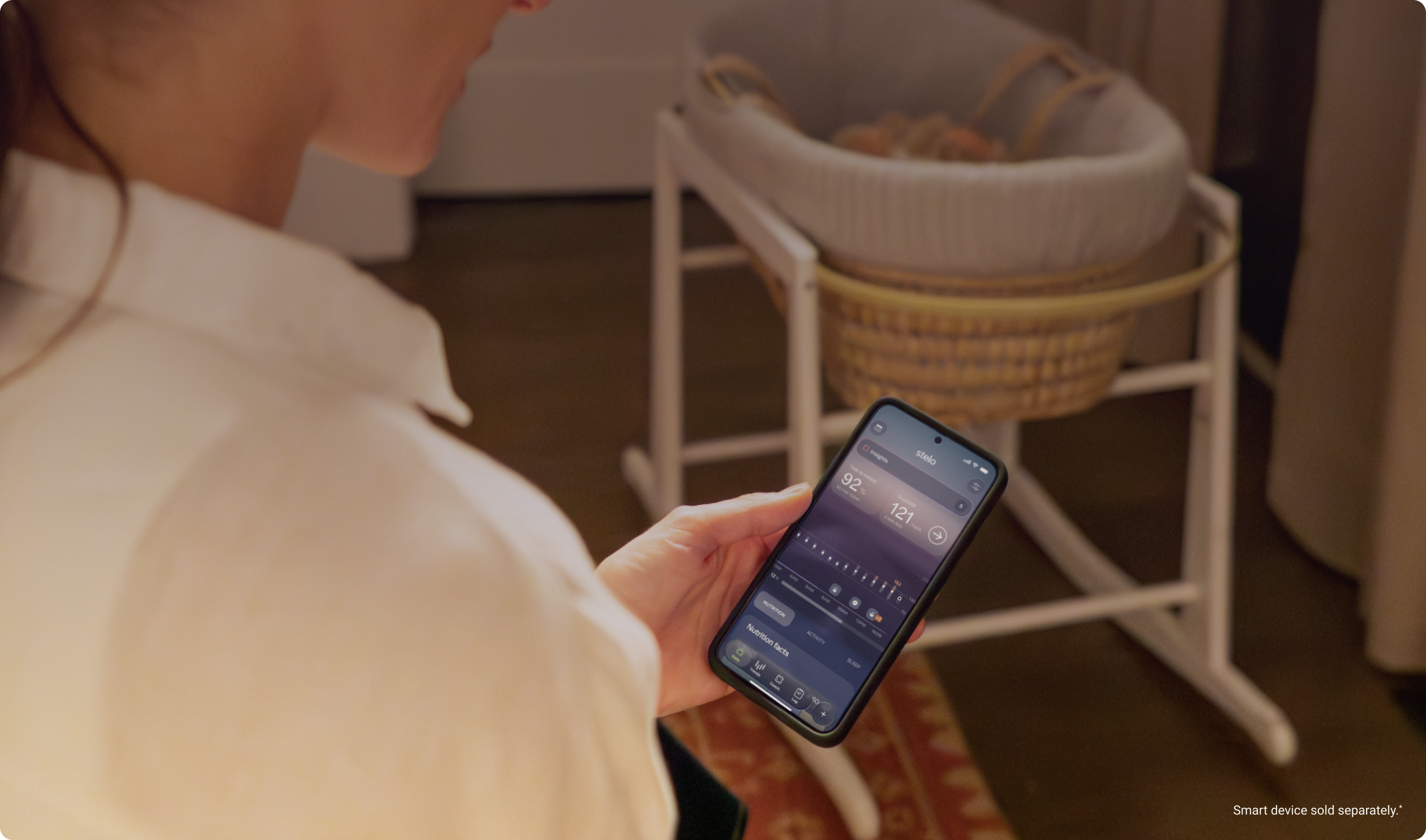 woman in nursery looking at stelo app