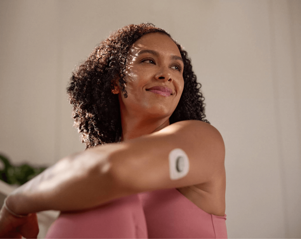 woman wearing stelo glucose biosensor