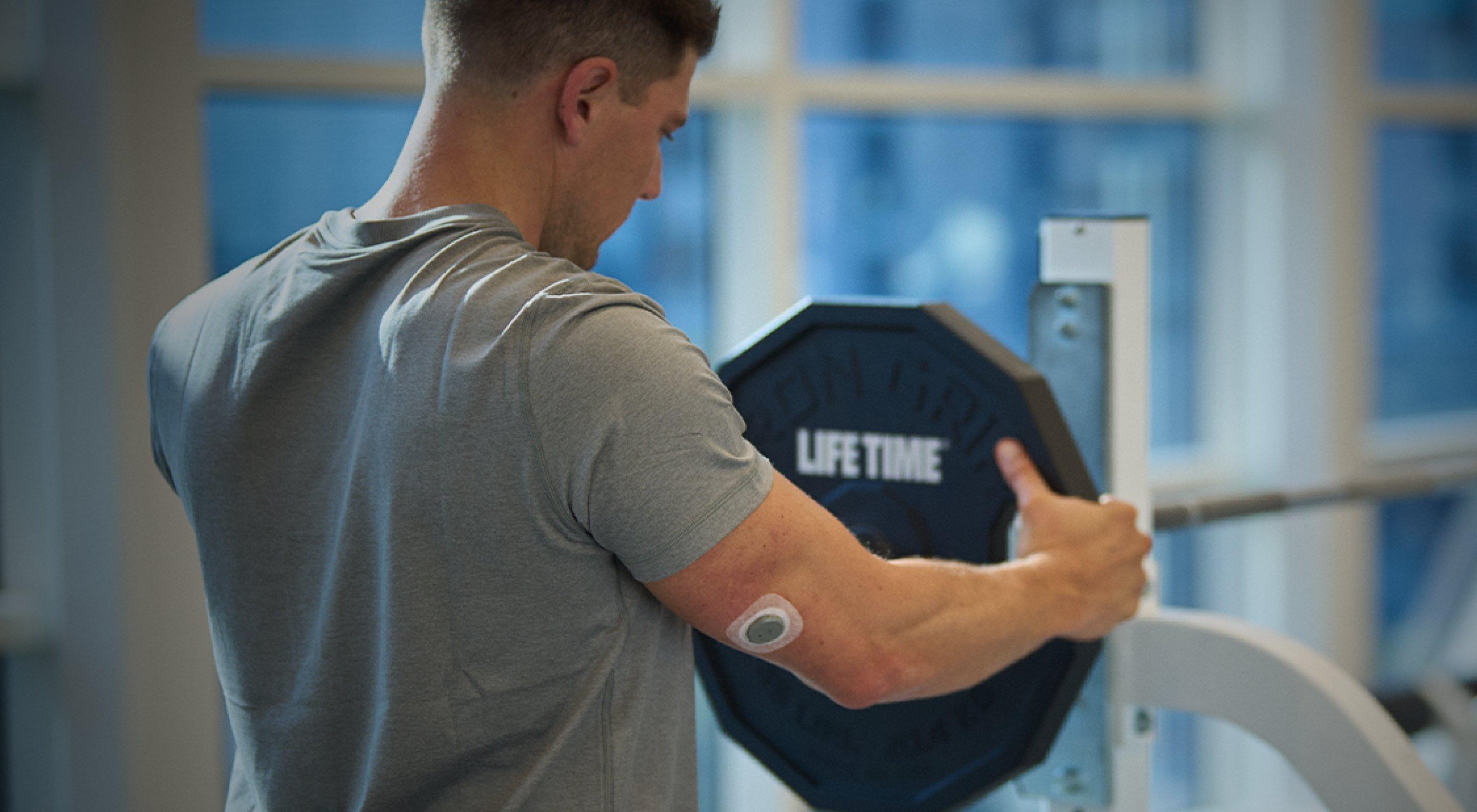 man putting on a weight