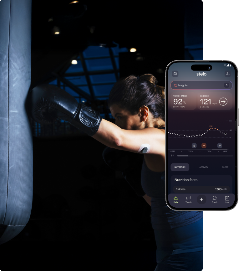 woman wearing stelo and leaning against punching bag