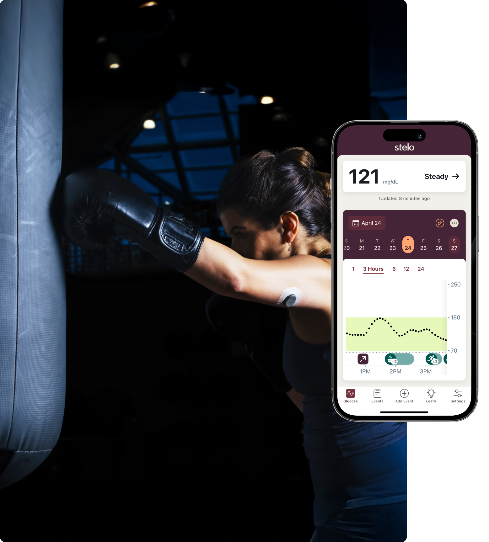 woman wearing stelo and leaning against punching bag