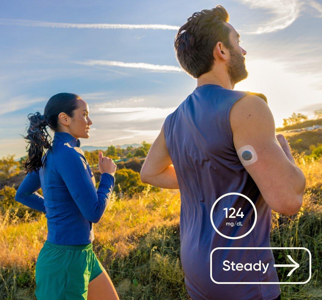 man and woman jogging outside together