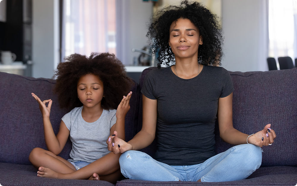 Mother and child meditating