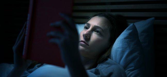 woman having a hard time falling asleep