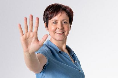 Woman holding up five fingers