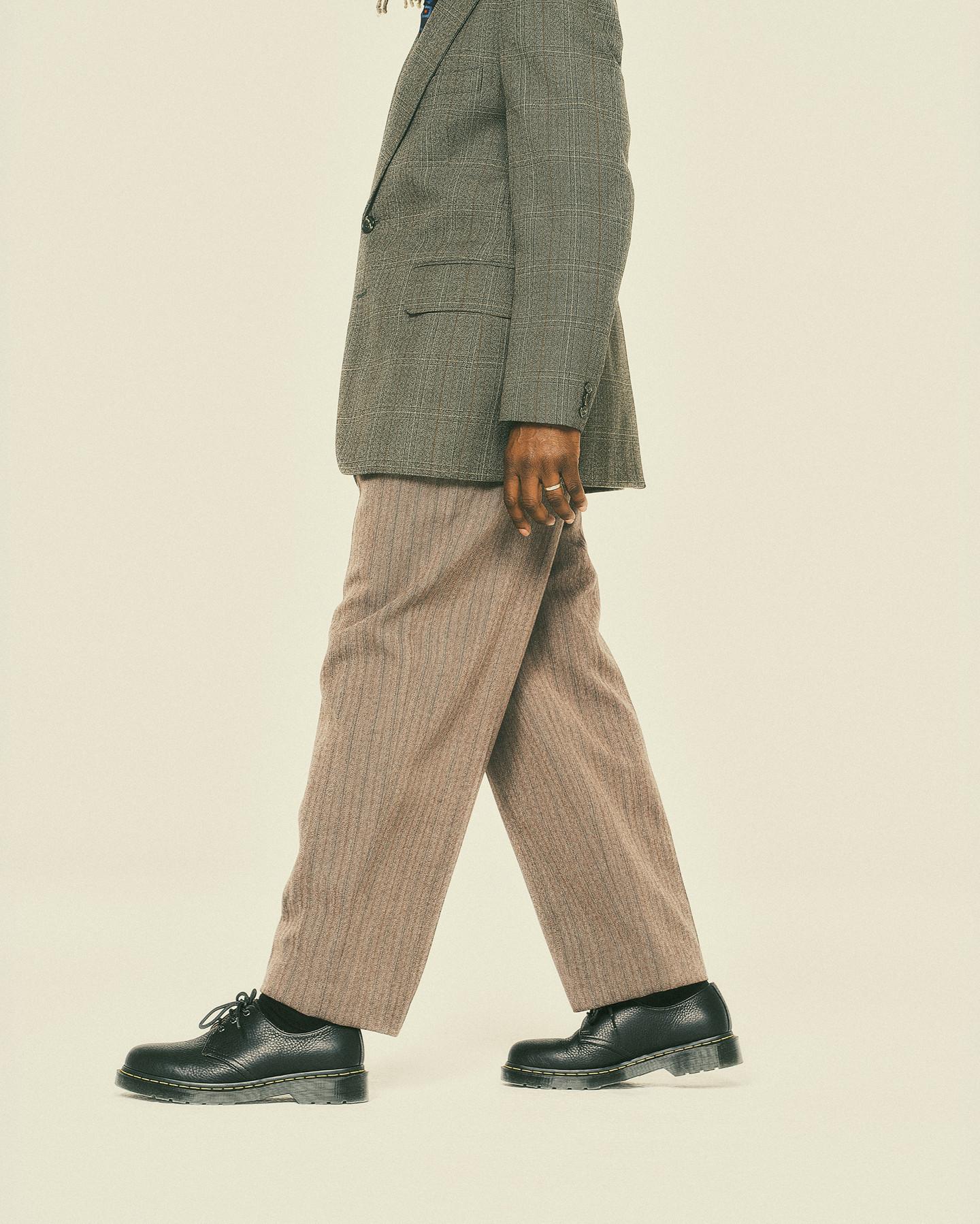 Black pebbled leather 3-eye shoes with yellow welt stitch, worn with cropped trousers