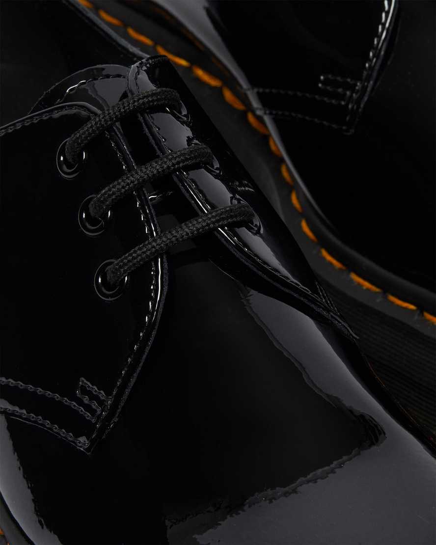 https://i1.adis.ws/i/drmartens/26647001.88.jpg?$large$1461 Quad Patent Leather Platform Shoes Dr. Martens