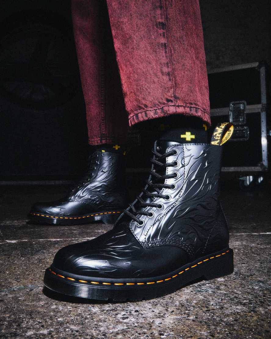https://i1.adis.ws/i/drmartens/27028001.88.jpg?$large$1460 Flames Emboss Leather Lace Up Boots Dr. Martens