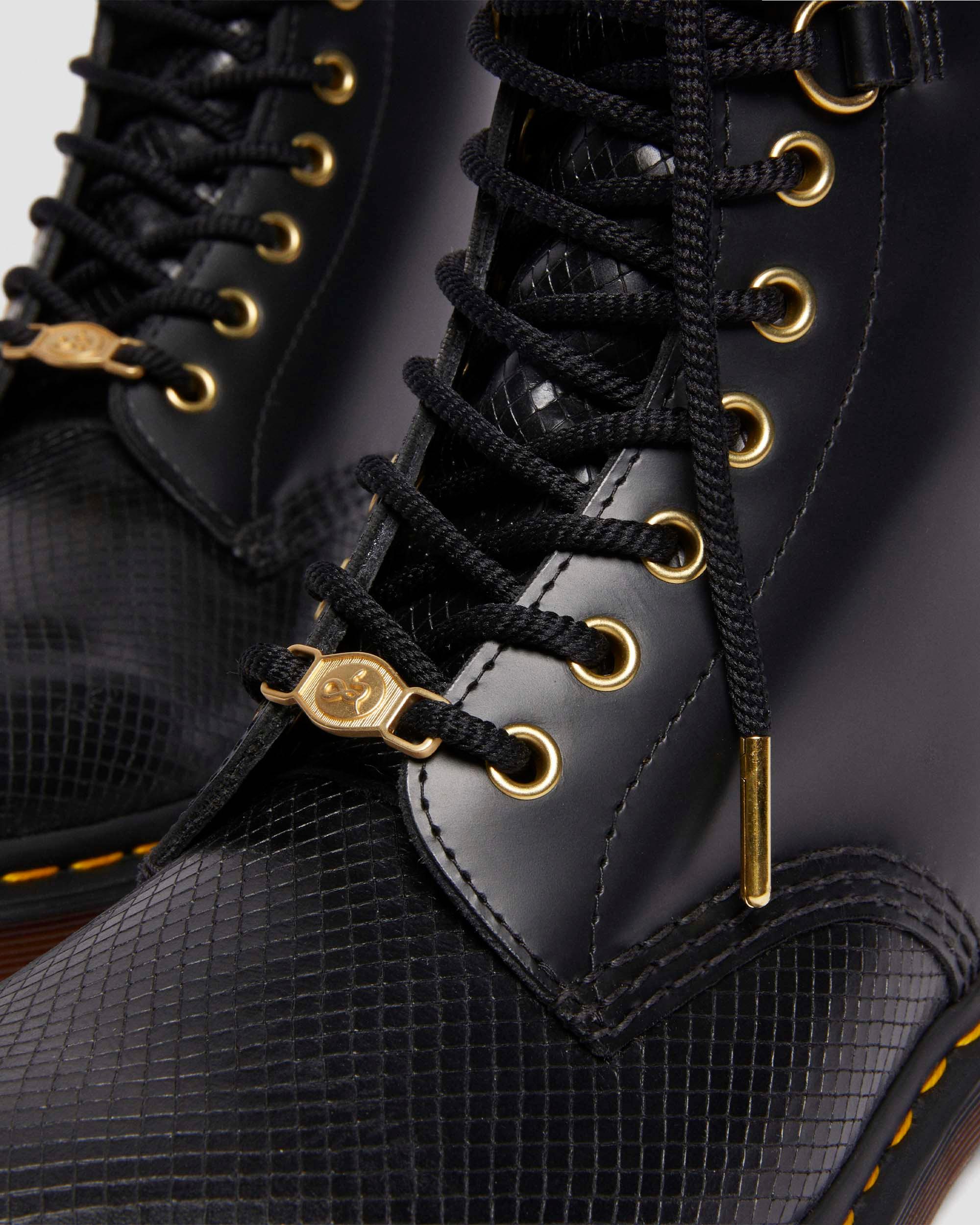 1460 Year of the Snake Leather Lace Up Boots in Black Dr. Martens