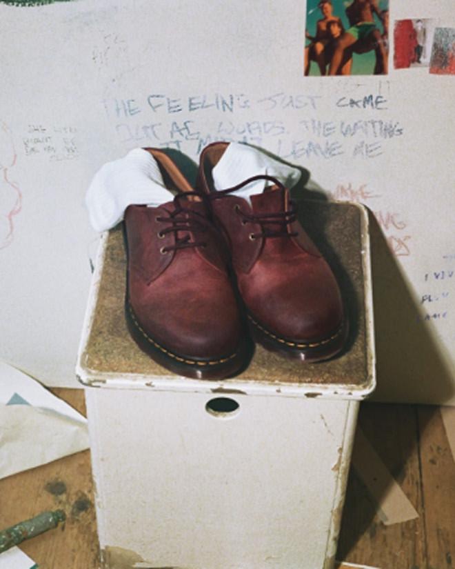 Burgundy leather 3-eye shoes with yellow welt stitching, worn with ribbed sports socks