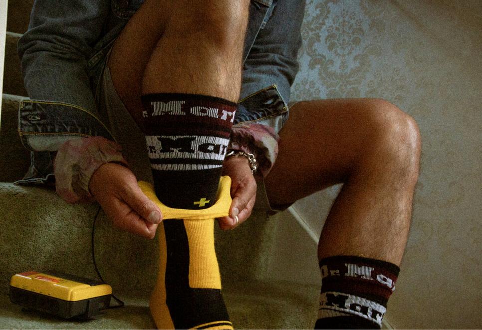 Socks being worn to help break in Dr. Martens shoes