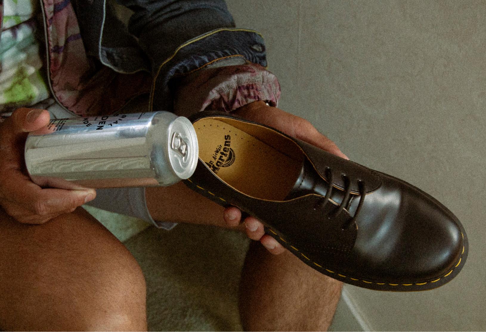 Image of a can being used to stretch out Dr. Martens shoes