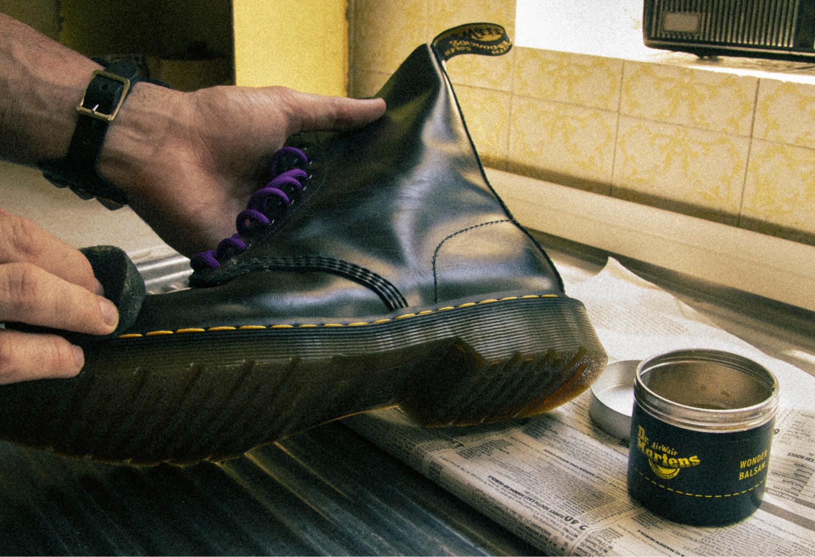 Image of applying Dr. Martens Wonder Balsam protector to shoes