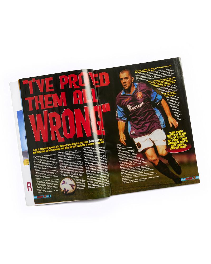 Open magazine spread with soccer player in a burgundy Dr. Martens jersey and bold red headline