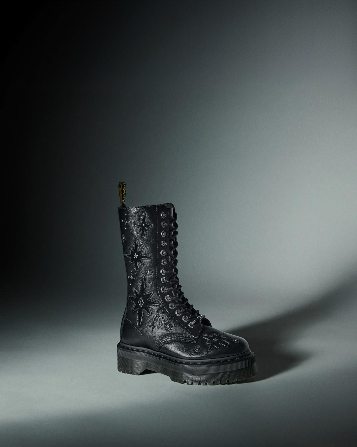 Deep purple leather lace-up boot with star and stud detailing on the ankle