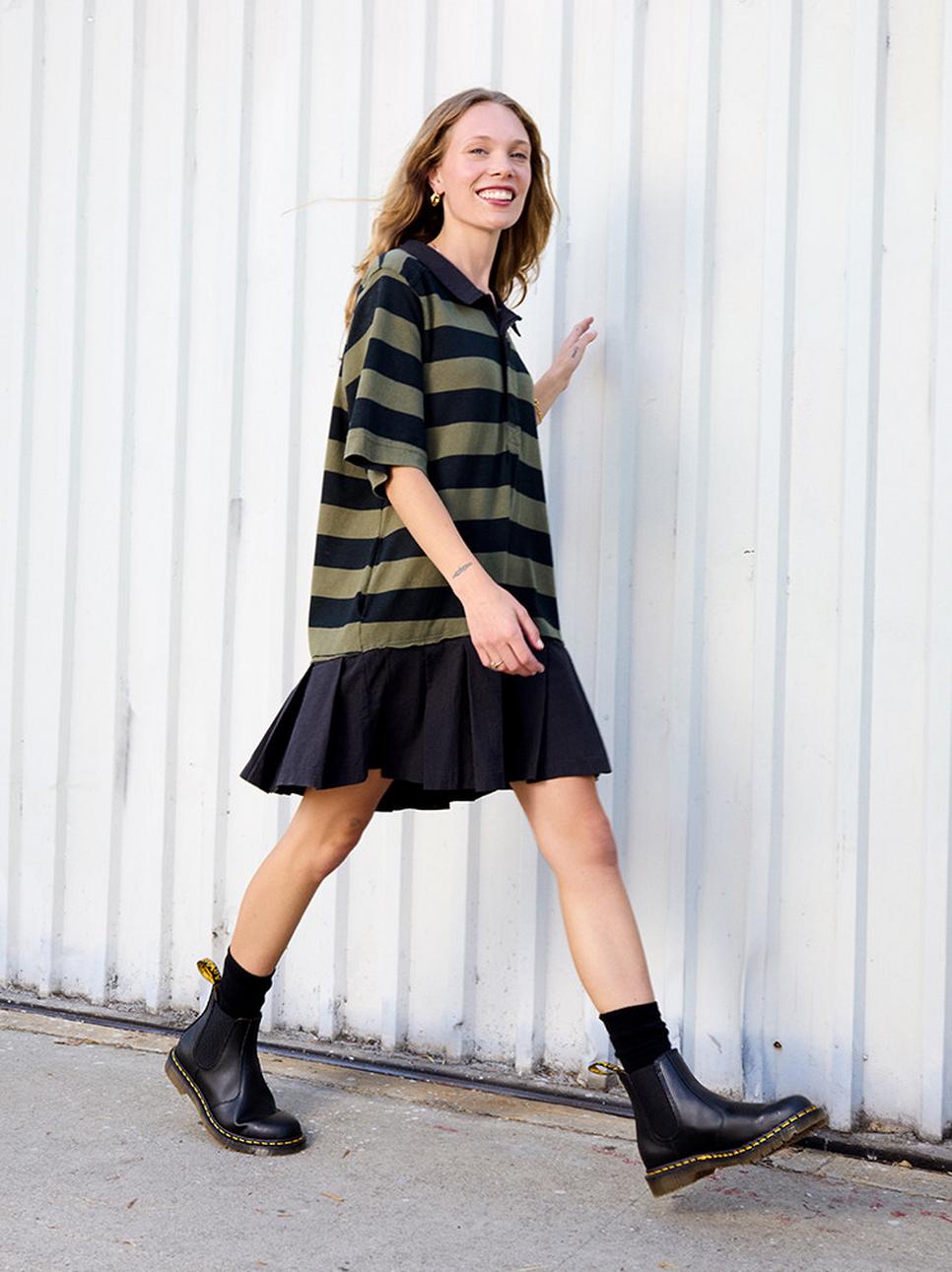 An oversize polo t-shirt and skirt styled with chelsea boots