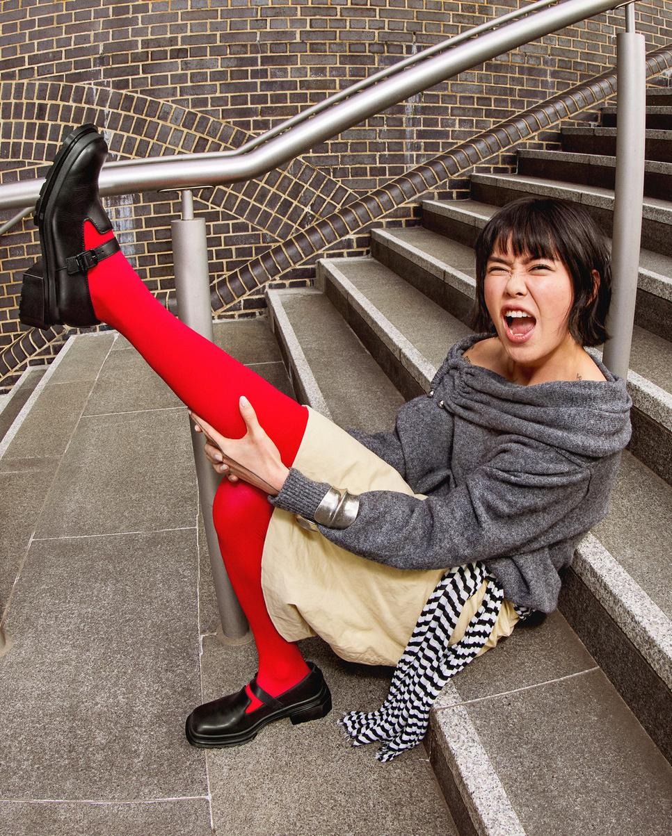 Dr. Martens black square toe mary jane shoes with red tights