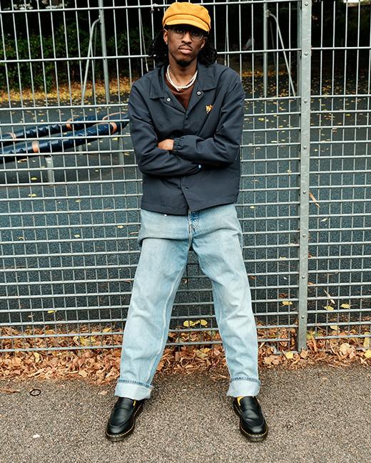 An outfit idea showing jeans paired with black penny loafers

