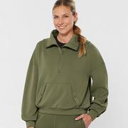 Woman wearing olive green loungewear set.