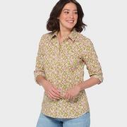 Woman wearing a floral printed button-down.