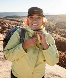 woman wearing aKHG Olympic Coast jacket hiking in Utah
