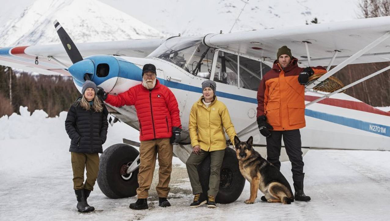 Shoemaker Family portrait with plane and dog in Alaska