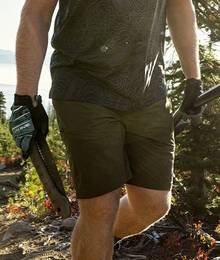 Man wearing AKHG shorts hiking in Washington