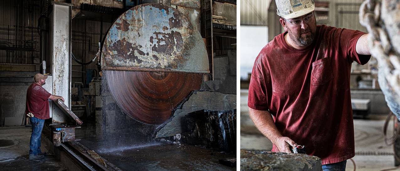 man in a red shirt and blue jeans cutting a stone with a large saw