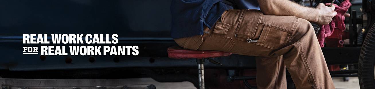 Real Work Calls for Real Work Pants, a man wearing brown pants working on a car
