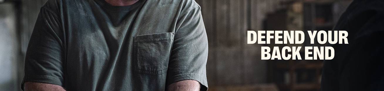 Headline: Defend Your Backend. Man wearing a t-shirt.